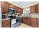 Modern kitchen boasts stainless steel appliances and granite countertops at 4396 Baldwin Ave. # 34, Little River, SC 29566