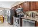 Gourmet kitchen boasts stainless appliances and ample counter space at 4396 Baldwin Ave. # 34, Little River, SC 29566