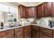 Kitchen sink with stainless steel faucet and granite countertops at 4396 Baldwin Ave. # 34, Little River, SC 29566