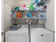 Laundry room with washer, dryer, and shelving for storage at 4396 Baldwin Ave. # 34, Little River, SC 29566