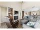 Spacious living room featuring a stone fireplace, comfortable seating, and ample natural light at 4396 Baldwin Ave. # 34, Little River, SC 29566