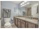 Double vanity bathroom with granite countertops and tile flooring at 4604 Ocean Blvd. S # 4C, North Myrtle Beach, SC 29582