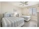 Bedroom with two twin beds, ceiling fan and window coverings at 4604 Ocean Blvd. S # 4C, North Myrtle Beach, SC 29582