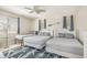 Three twin beds in a spacious bedroom with ceiling fan at 4604 Ocean Blvd. S # 4C, North Myrtle Beach, SC 29582