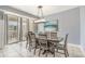 Dining room with glass-top table and ocean-view access at 4604 Ocean Blvd. S # 4C, North Myrtle Beach, SC 29582
