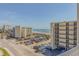 Breathtaking ocean view from the balcony, showcasing beach and cityscape at 4604 Ocean Blvd. S # 4C, North Myrtle Beach, SC 29582