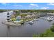 Aerial view of waterfront community with lighthouse, marina, and homes at 4641 Lightkeepers Way # 3A, Little River, SC 29566