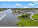 Aerial view of a waterfront community and marina with boat traffic at 4641 Lightkeepers Way # 3A, Little River, SC 29566