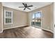 Bright bedroom with hardwood floors and sliding glass doors to a porch at 4641 Lightkeepers Way # 3A, Little River, SC 29566