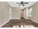 Spacious bedroom with hardwood floors and ceiling fan at 4641 Lightkeepers Way # 3A, Little River, SC 29566
