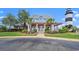 Community clubhouse with lighthouse view, landscaping, and porch at 4641 Lightkeepers Way # 3A, Little River, SC 29566