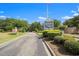 Paved entrance to Lighthouse Village waterfront community at 4641 Lightkeepers Way # 3A, Little River, SC 29566