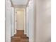 Hallway with light walls, hardwood floors, and double door closets at 4641 Lightkeepers Way # 3A, Little River, SC 29566