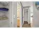 Hallway with linen closet, additional closet, and a small bathroom at 4641 Lightkeepers Way # 3A, Little River, SC 29566