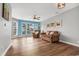Bright living room with hardwood floors and bay window at 4641 Lightkeepers Way # 3A, Little River, SC 29566