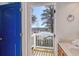 Bright full bathroom with a door open to a balcony with a waterfront view at 502 Castellar Ln., Little River, SC 29566