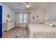 Bright and airy bedroom featuring a queen bed, dresser and a ceiling fan at 502 Castellar Ln., Little River, SC 29566