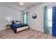 Bedroom with a full-sized bed, accent wall hanging and light-blocking curtains at 502 Castellar Ln., Little River, SC 29566