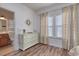 Bedroom with a dresser, light-blocking curtains and a bright blue door at 502 Castellar Ln., Little River, SC 29566