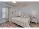 Comfortable bedroom with a queen bed, neutral decor, and a ceiling fan at 502 Castellar Ln., Little River, SC 29566