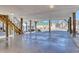 Spacious carport with access to yard and green-roofed building in the background at 502 Castellar Ln., Little River, SC 29566