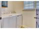 Functional laundry room with washer and dryer units offering convenience and efficiency for household chores at 502 Castellar Ln., Little River, SC 29566