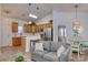 Modern living room with open floor plan, seamlessly connecting the kitchen, living, and dining areas at 502 Castellar Ln., Little River, SC 29566