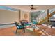 Outdoor patio with comfortable seating, ceiling fan, stairs and decorative decor at 502 Castellar Ln., Little River, SC 29566