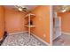 A brightly lit room for storage, with white cabinets and vinyl flooring at 502 Castellar Ln., Little River, SC 29566