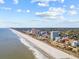 Extensive aerial view of coastline with beachfront condos, hotels, and wide sandy beach at 5511 N Ocean Blvd. # 302, Myrtle Beach, SC 29577