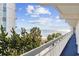 Balcony view with palm trees, ocean view, and white railing in a beachfront setting at 5511 N Ocean Blvd. # 302, Myrtle Beach, SC 29577