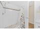 Clean bathroom featuring a shower with a floral-patterned curtain and mosaic tile accents at 5511 N Ocean Blvd. # 302, Myrtle Beach, SC 29577