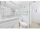Bright bathroom featuring a white vanity, a toilet, and a shower-tub combination at 5511 N Ocean Blvd. # 302, Myrtle Beach, SC 29577