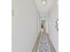 Hallway with light-colored walls, wood-look flooring, and doors leading to other rooms at 5511 N Ocean Blvd. # 302, Myrtle Beach, SC 29577