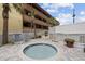 Relaxing outdoor hot tub with brick patio, providing a private and comfortable retreat for residents to unwind and enjoy the weather at 5511 N Ocean Blvd. # 302, Myrtle Beach, SC 29577