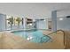 Bright indoor pool area with large windows and comfortable lounging space, providing year-round recreational opportunities for residents at 5511 N Ocean Blvd. # 302, Myrtle Beach, SC 29577