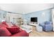 Inviting living room with bright light blue walls and modern coastal decor, complete with barstool seating at 5511 N Ocean Blvd. # 302, Myrtle Beach, SC 29577