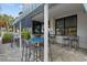 Outdoor patio with tables and chairs under a blue-striped awning, offering a relaxed dining experience at 5511 N Ocean Blvd. # 302, Myrtle Beach, SC 29577