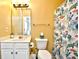 Bathroom with a toilet, sink, and shower with a sea-themed curtain at 6015 Catalina Dr. # 431, North Myrtle Beach, SC 29582