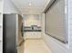 Modern community kitchen featuring stainless steel appliances and light wood cabinets at 6015 Catalina Dr. # 431, North Myrtle Beach, SC 29582