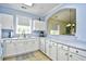Bright kitchen with white cabinets, granite counters, and a pass-through to the dining area at 6015 Catalina Dr. # 431, North Myrtle Beach, SC 29582