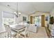 Open living space with vaulted ceiling, access to balcony, and plenty of natural light at 6015 Catalina Dr. # 431, North Myrtle Beach, SC 29582