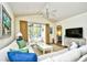 Bright living room with sectional sofa, balcony access, and flat-screen TV at 6015 Catalina Dr. # 431, North Myrtle Beach, SC 29582