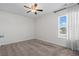 Bright bedroom with carpeted floor, ceiling fan, and window with blinds at 626 Notting Hill Ct., Conway, SC 29526