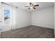 Spacious bedroom with ceiling fan and large window at 626 Notting Hill Ct., Conway, SC 29526