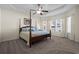 Spacious Primary bedroom with carpeted floors and ceiling fan at 626 Notting Hill Ct., Conway, SC 29526