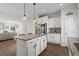 Island kitchen features granite countertops and stainless steel appliances at 626 Notting Hill Ct., Conway, SC 29526