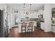 Modern kitchen with white cabinets, granite countertops, and stainless steel appliances at 626 Notting Hill Ct., Conway, SC 29526