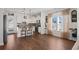 Modern kitchen with white cabinets, granite countertops, and stainless steel appliances at 626 Notting Hill Ct., Conway, SC 29526