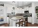 Modern kitchen with white cabinets, granite countertops, and stainless steel appliances at 626 Notting Hill Ct., Conway, SC 29526
